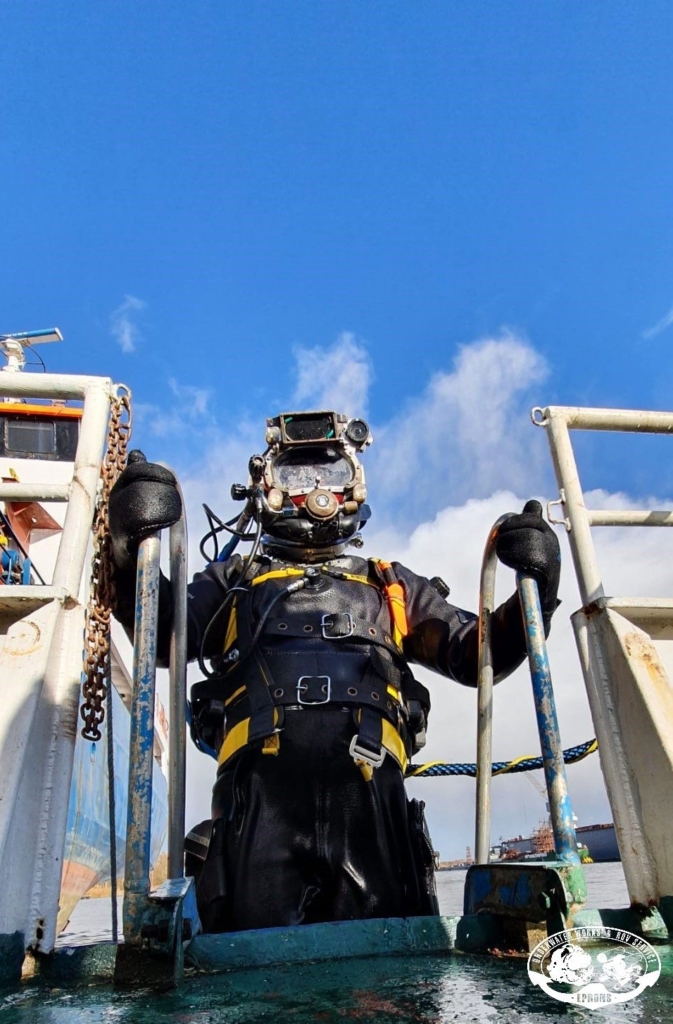EPRONS diver entering the water from the diving vessel ladder